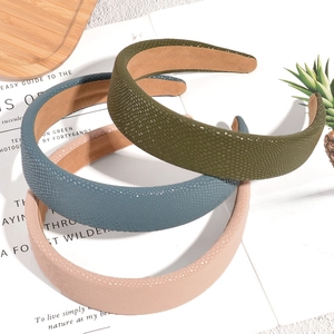 Classic solid color faux leather headbands in olive green, blue and pink with grain texture