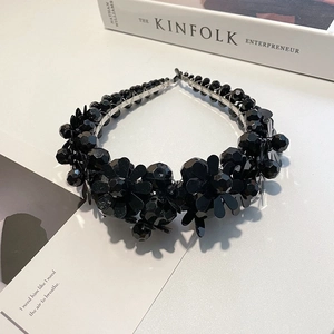 Detail of elegant black beaded floral headband featuring 3D flowers and intricate beads
