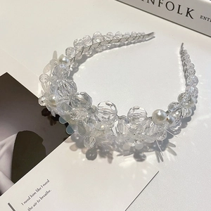 Elegant beaded headband with crystal beads and white pearls on a slim metal base