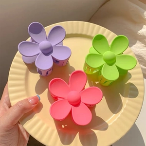Matte flower hair clips set in purple, green, and pink colors for elegant styling