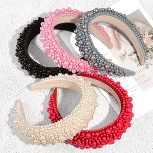 Padded velvet headband with assorted pearls in black, pink, grey, beige, and red colors