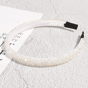 Detail of beaded headband showing anti-slip fabric lining and iridescent crystal beads