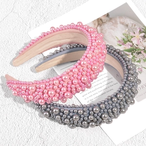 Chic padded pearl headbands in pink and grey colors with clustered faux pearl embellishments