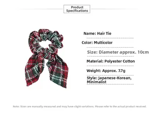 Detail showing 10cm Christmas plaid scrunchie with bunny ears made of poly-cotton fabric