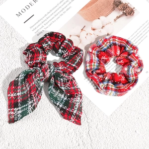 Christmas plaid scrunchie set with white snowflake pattern and bunny ear bow detail