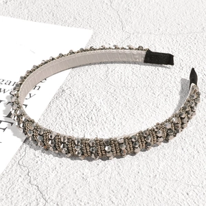 Close-up of rhinestone headband showing gray faceted beads and anti-slip lining detail