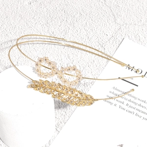 Elegant gold metal headband set with rhinestone feather and pearl infinity symbol designs