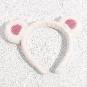Plush white cat ear headband with pink glitter accents for skincare and makeup styling