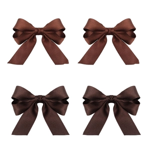 Detail view of 4-piece set deep brown bow hair clips with shiny satin ribbon and secure grip