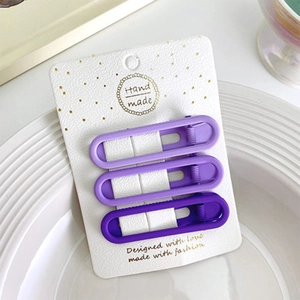 Set di tre fermagli per capelli viola opaco con eleganti design ovali scavati