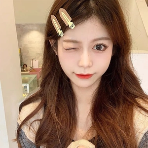 Set of two matte camel brown duckbill hair clips worn by a model for styling