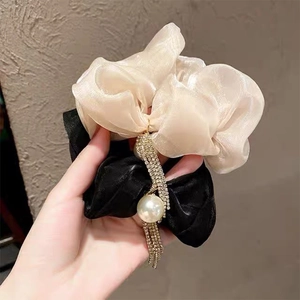 Elegant scrunchie set with rhinestone tassels and faux pearl dangles in champagne and black