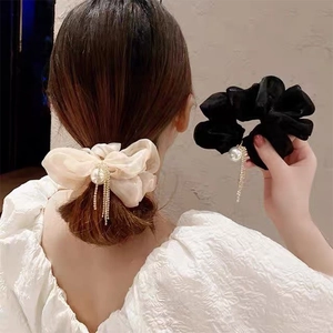 Elegant scrunchie with large pearl and sparkling rhinestone tassels in cream and black