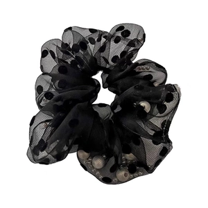Elegant mesh scrunchie with black polka dots and interior pearl beads for hair styling