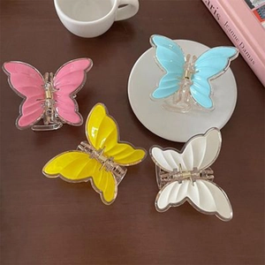 Set of four colorful butterfly hair claws in pink blue yellow and white acrylic