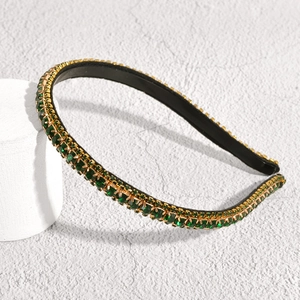 Elegant emerald green rhinestone headband with gold metal plating for a luxury vintage look