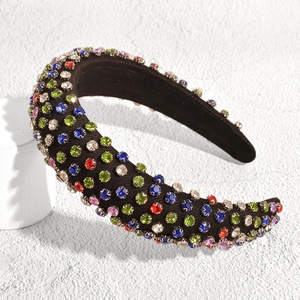 Detail shot of a wide padded headband featuring vibrant multi-colored crystal rhinestones
