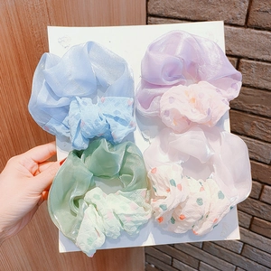 Four-pack elegant chiffon scrunchies in pastel colors with polka dots and satin finish