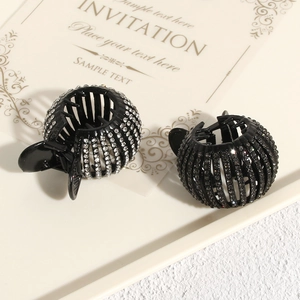 Close-up of bird nest hair clips with sparkling rhinestones and expandable design