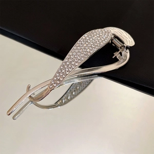 Elegant silver banana hair clip with sparkling rhinestones and a curved cross design