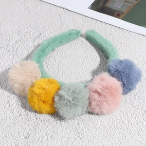 Green plush headband with five colorful fluffy faux fur balls for girls' hair styling