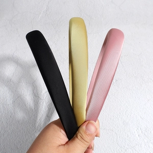 Minimalist satin padded headbands in black, gold, and pink colors for women