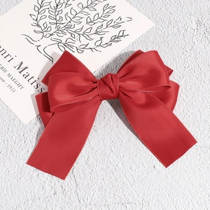 Elegant red satin bow hair clip with a double-layered design for a sophisticated look