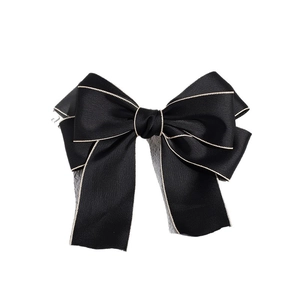 Elegant French black satin bow hair clip with white stitching and long ribbons