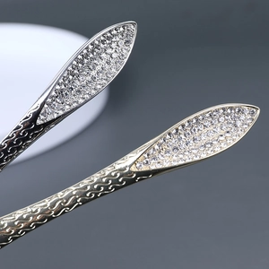 Épingles à cheveux élégantes or et argent avec feuilles en strass et motifs de vagues