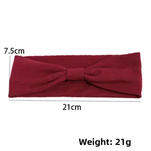 Detail view of burgundy knitted headband showing 21x7.5cm dimensions and ribbed texture