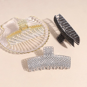 Elegant large metal hair clips with pearls and rhinestones in gold, silver, and black