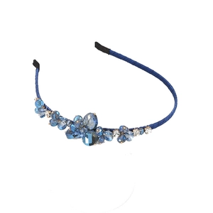 Blue crystal floral headband with handmade rhinestone beads on a fabric wrapped base