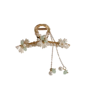 Elegant lily of the valley hair claw with pearls and long tassels in gold finish