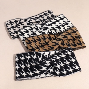 Close-up of houndstooth knitted headbands with twist knot design in various colors