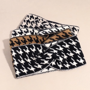 Three houndstooth knit headbands with cross-knot design in black, camel, and beige colors
