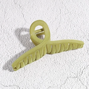 Macro detail of large matte Morandi green square hair claw clip with cross design