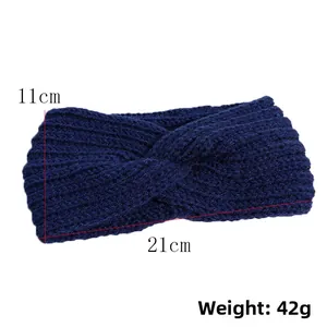 Winter knitted navy headband with twist knot design measuring 21cm by 11cm and 42g