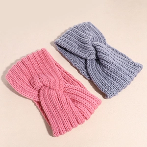 Knitted elastic winter headbands in pink and gray featuring a stylish knotted twist design