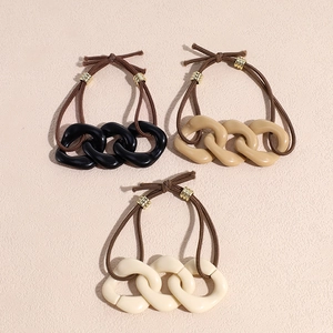 Three minimalist bow hair ties in milk coffee shades with resin chain links and metal rings