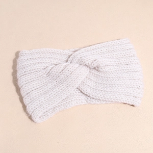 Close-up of white ribbed knit headband featuring a stylish central twist detail