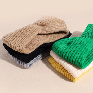 Elastic knitted twist headband in various colors for winter warmth and hair styling