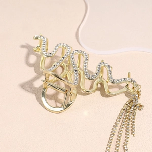 Molla per capelli in metallo dorato con strass brillanti e lunghe nappe pendenti