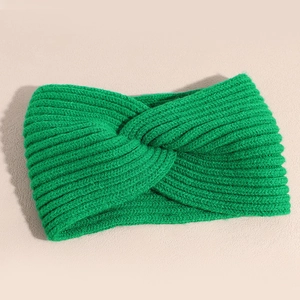 Detailed texture of bright green knitted twist headband with thick elastic wool pattern