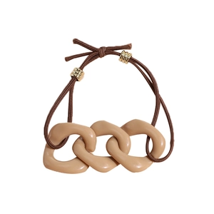 Minimalist coffee brown elastic hair tie with beige chain links and gold metal accents