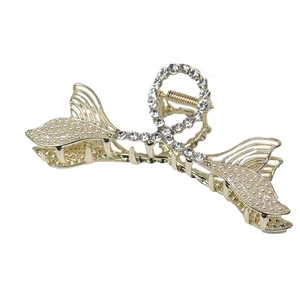 Elegant gold fishtail claw clip featuring white pearls and sparkling rhinestones
