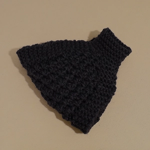 Close-up of black chunky knit headband featuring a thick 3D honeycomb woven texture