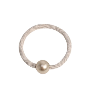 Minimalist elastic hair tie in cream ribbed fabric with a matte gold bead accent