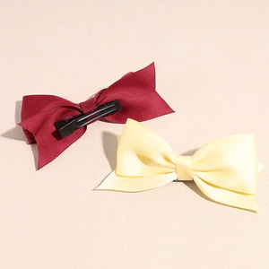 Elegant satin bow hair clips in burgundy and yellow with metal duckbill clips