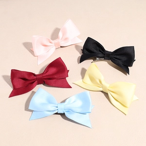 5-piece set of satin bow hair clips in pink, black, red, yellow, and blue colors