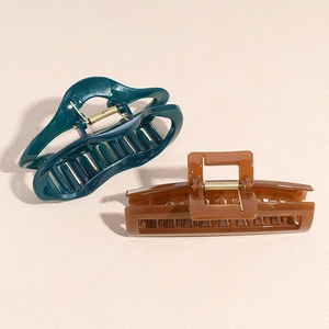 French vintage acetate hair claws in dark teal oval and amber brown rectangle styles
